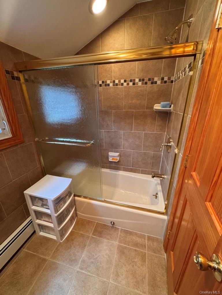Full bath upstairs, with tub and shower, glass enclosure