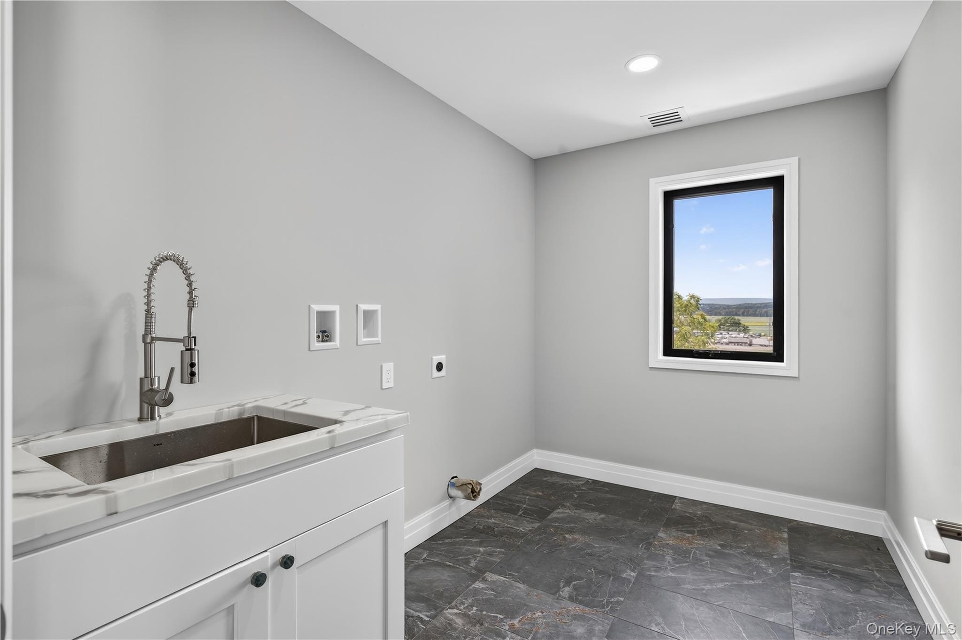 Laundry room featuring washer hookup, hookup for an electric dryer, cabinet space, and recessed lighting