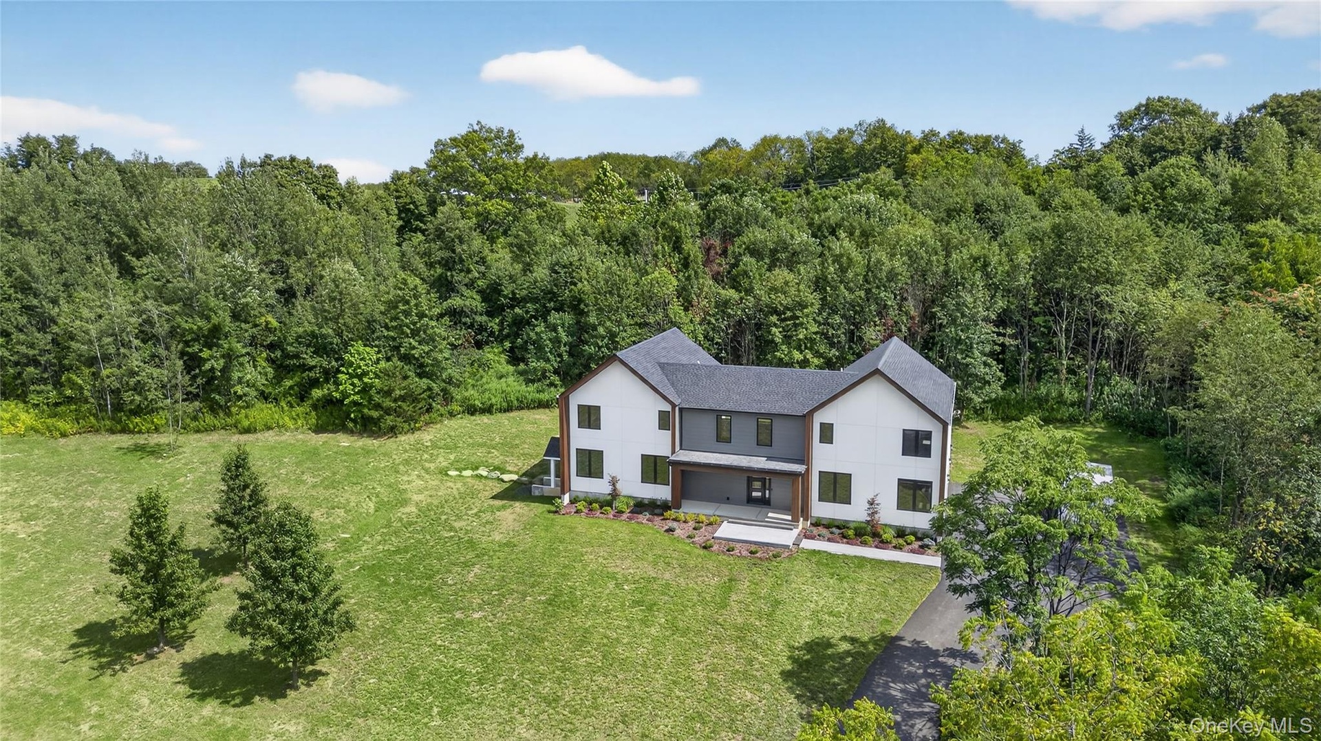 View from above of property with a heavily wooded area