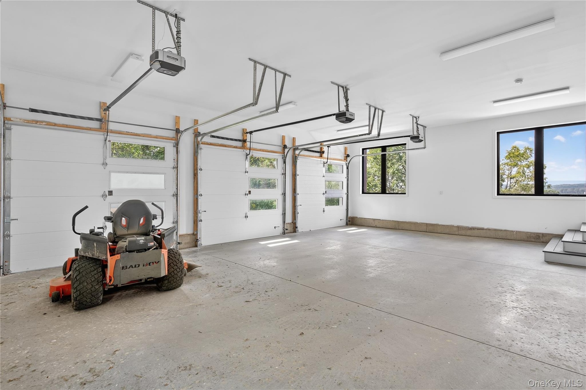 Garage featuring a garage door opener