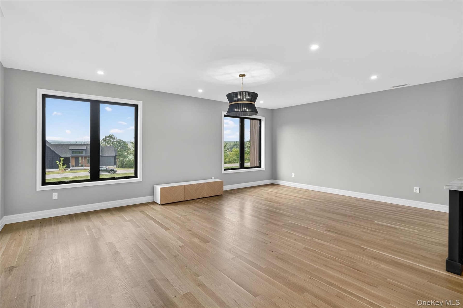 Unfurnished living room featuring light wood-type flooring and recessed lighting