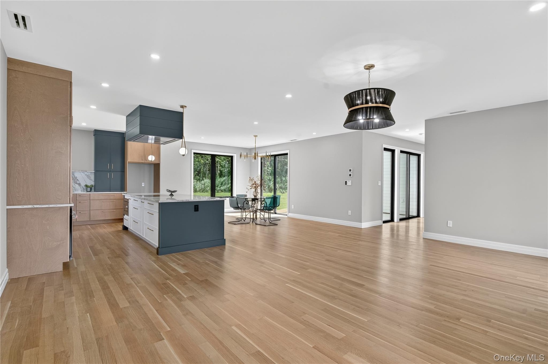 Unfurnished living room with recessed lighting and light wood finished floors