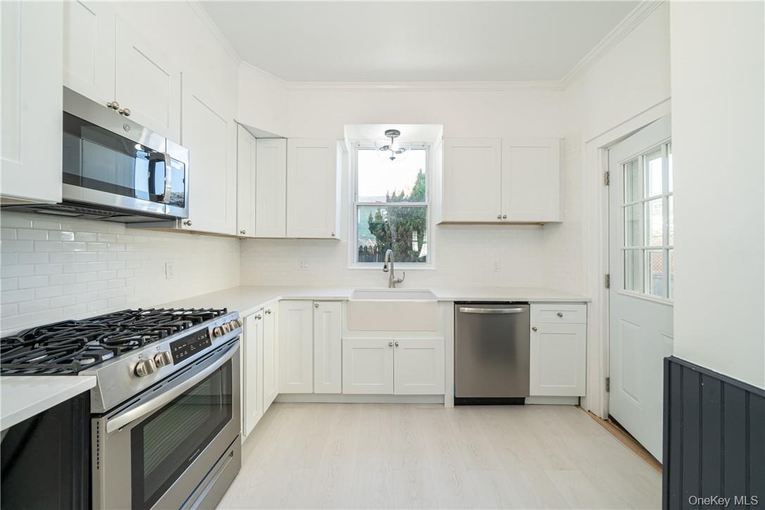 Be the first to enjoy this fully renovated Eat In Kitchen with Stainless Steel appliances (2020). Access to ginormous backyard deck and first floor wa