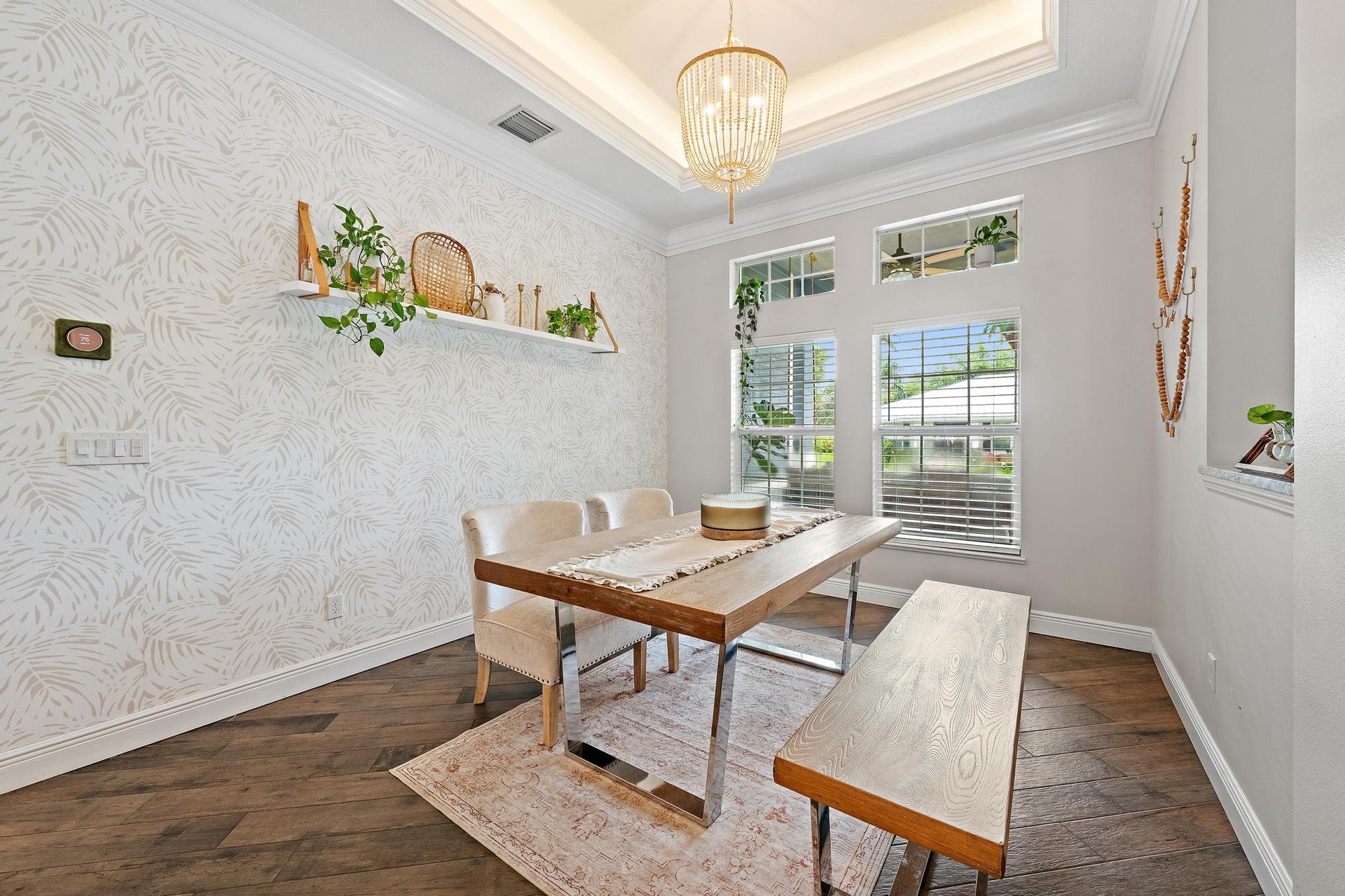 A spacious Dining Room with view of the Front Porch allowing ample Natural Light to flow through the home effortlessly.