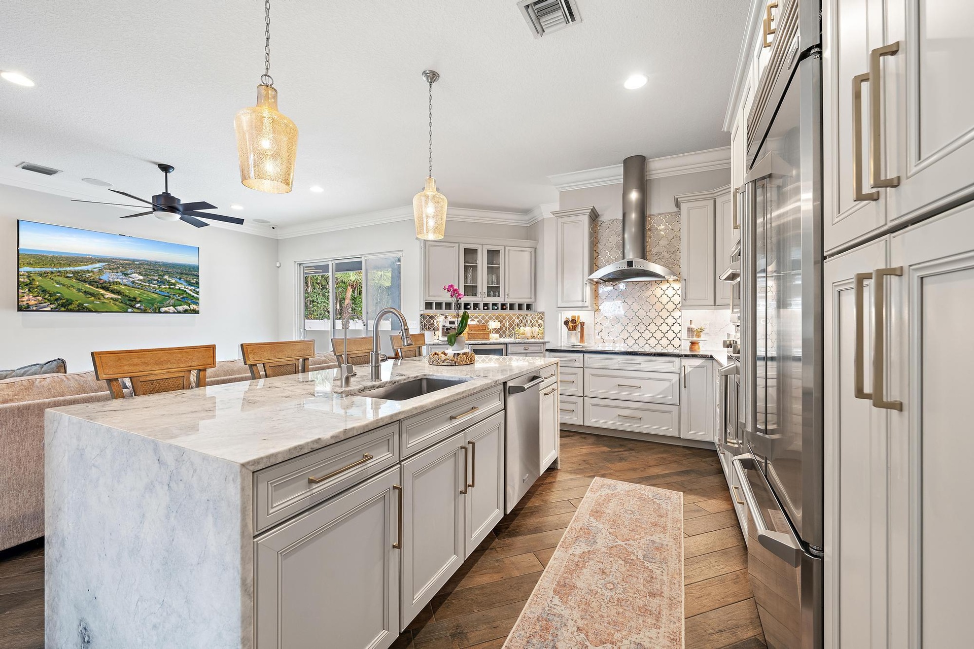 Elevated soft close cabinetry and finishes are perfectly accented by GE Monogram Appliances.