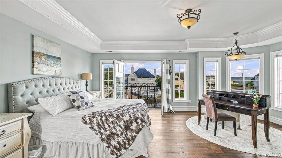 Primary en suite bedroom overlooking stunning water views.