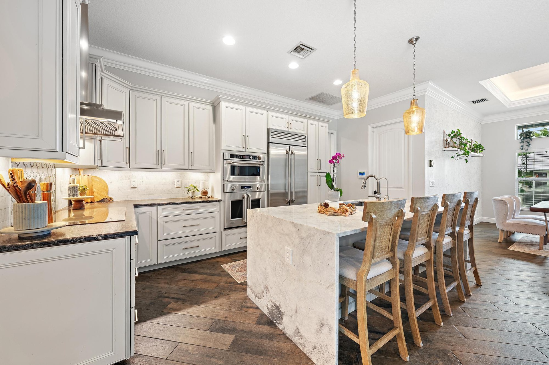Complete with Waterfall Island, Marble and Natural Stone Countertops, Seating for 4 and so much more!