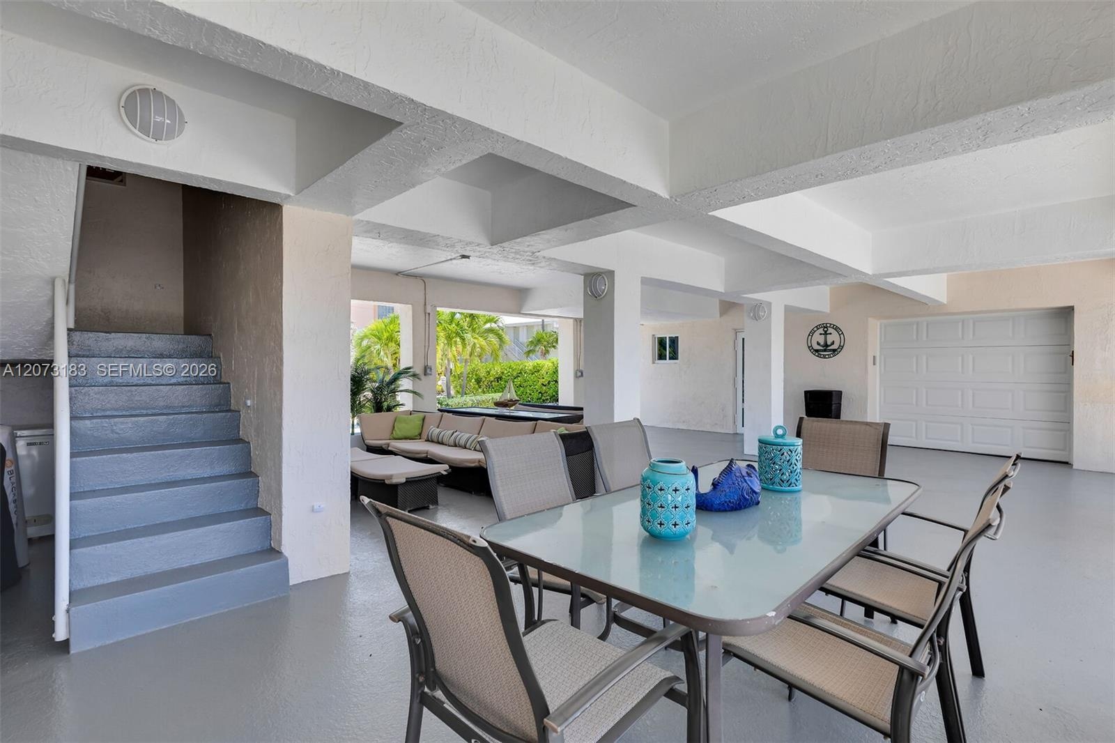 Interior staircase, Large Patio with dual dining, BBQ and access to water