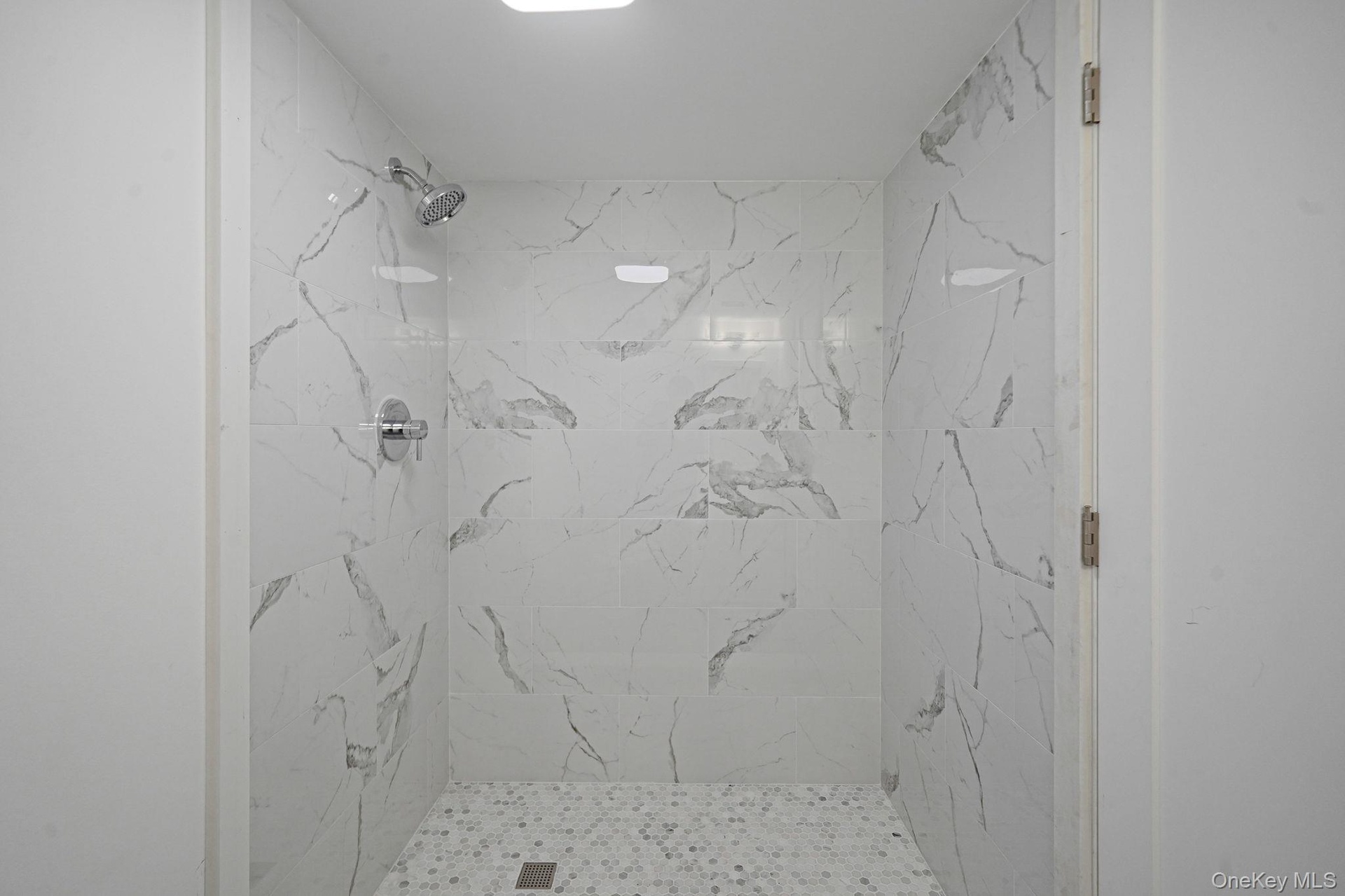 Bathroom with tiled shower