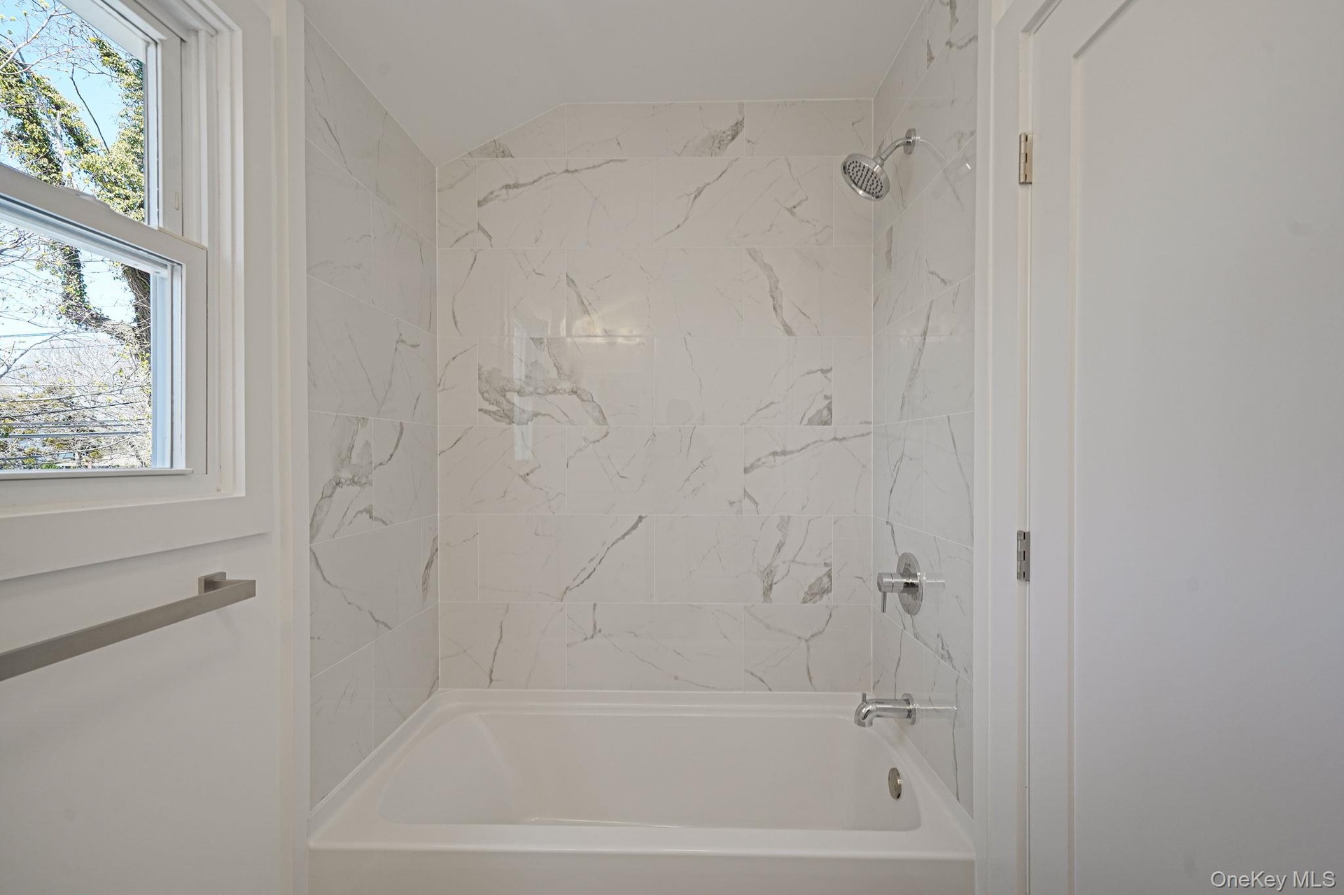 Full bath featuring tub / shower combination