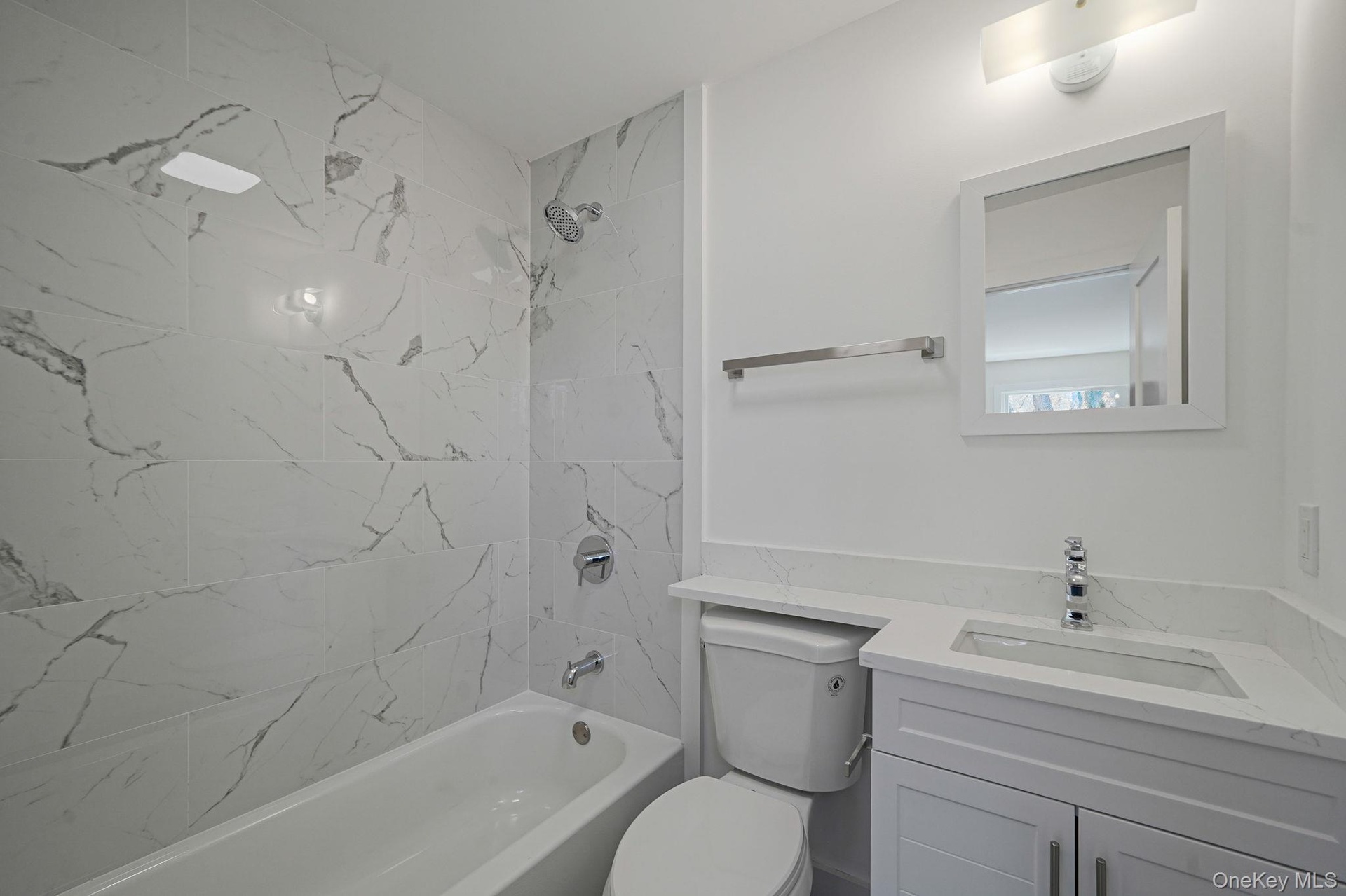 Full bath featuring vanity, toilet, and shower / bath combination