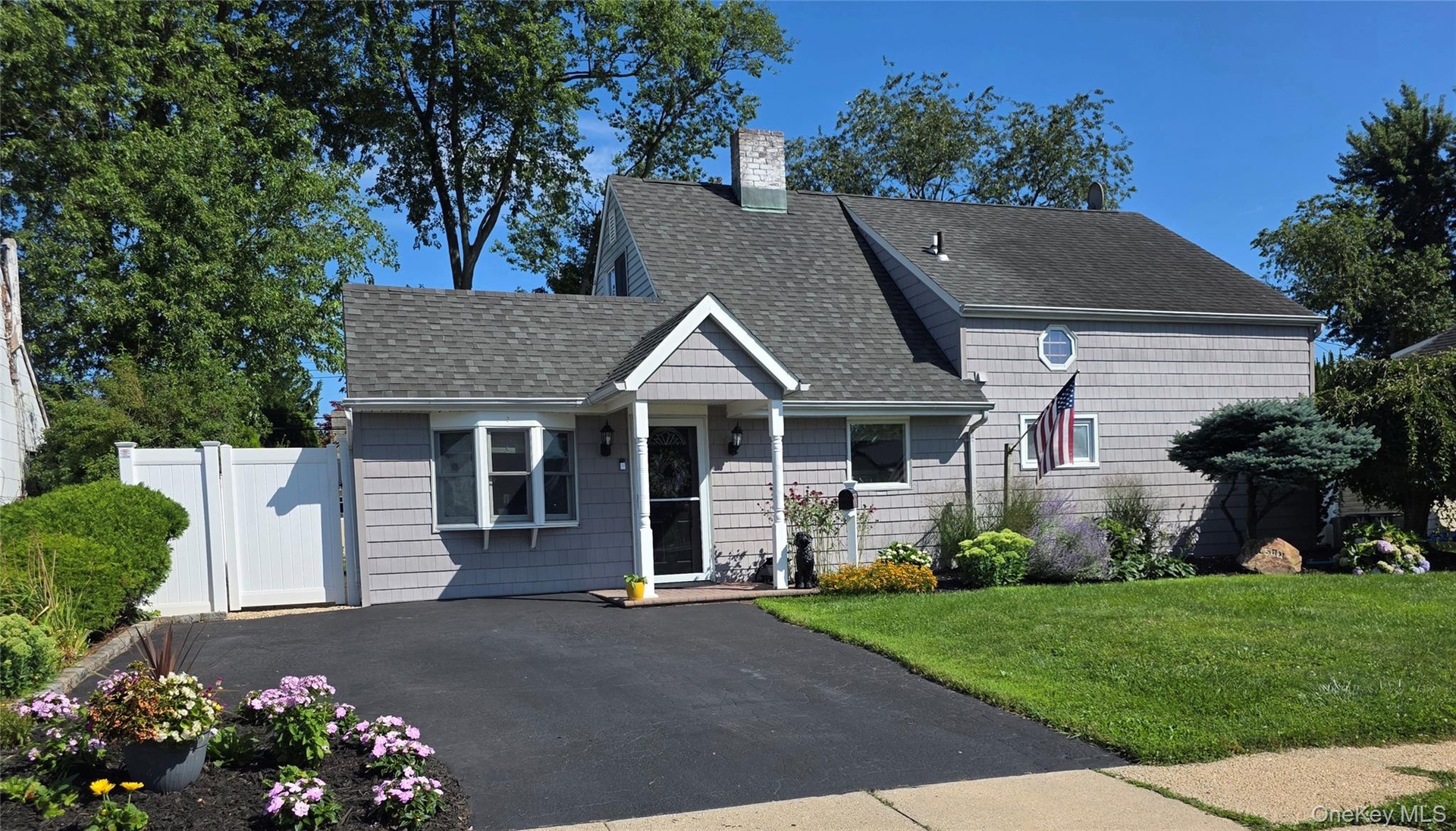 Lovely curb appeal with and  newly sealed driveway!