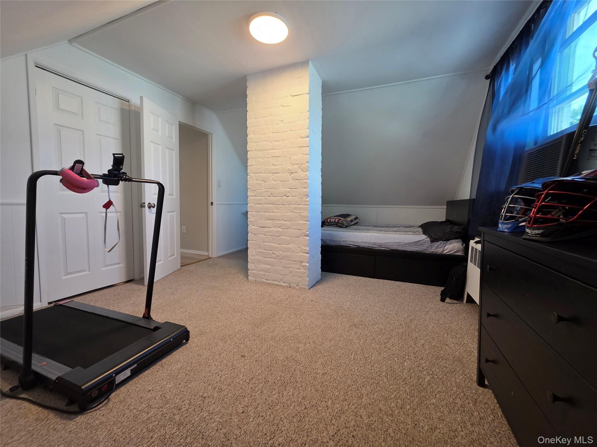 Bedroom 3 - Freshly painted in 2026 - 1 A/C window unit - closet with scuttle attic access for extra storage - carpet