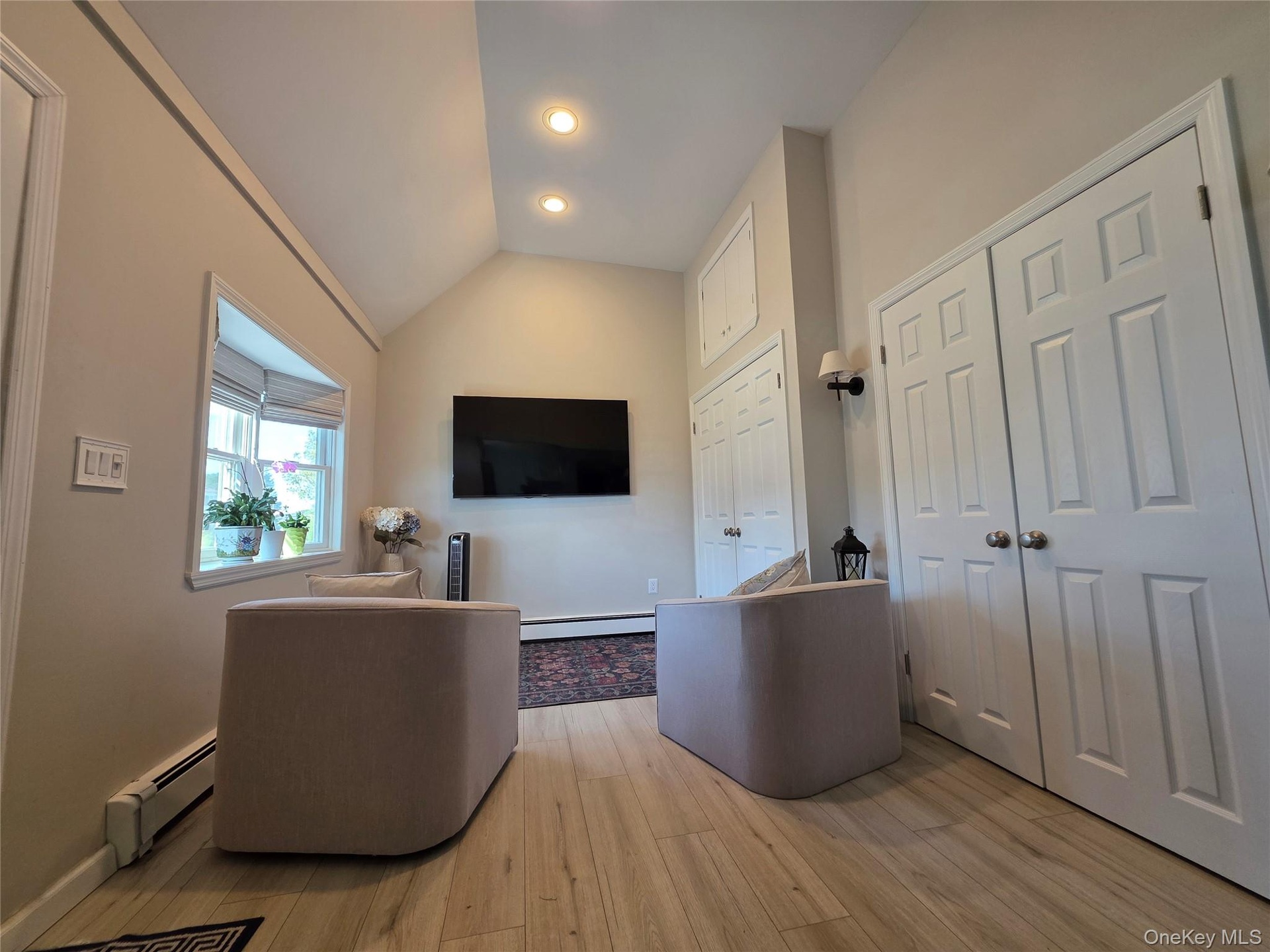 "Hearth Room" with Bay Window, Cathedral Ceiling, recessed lighting with plenty of storage in double door coat closet!