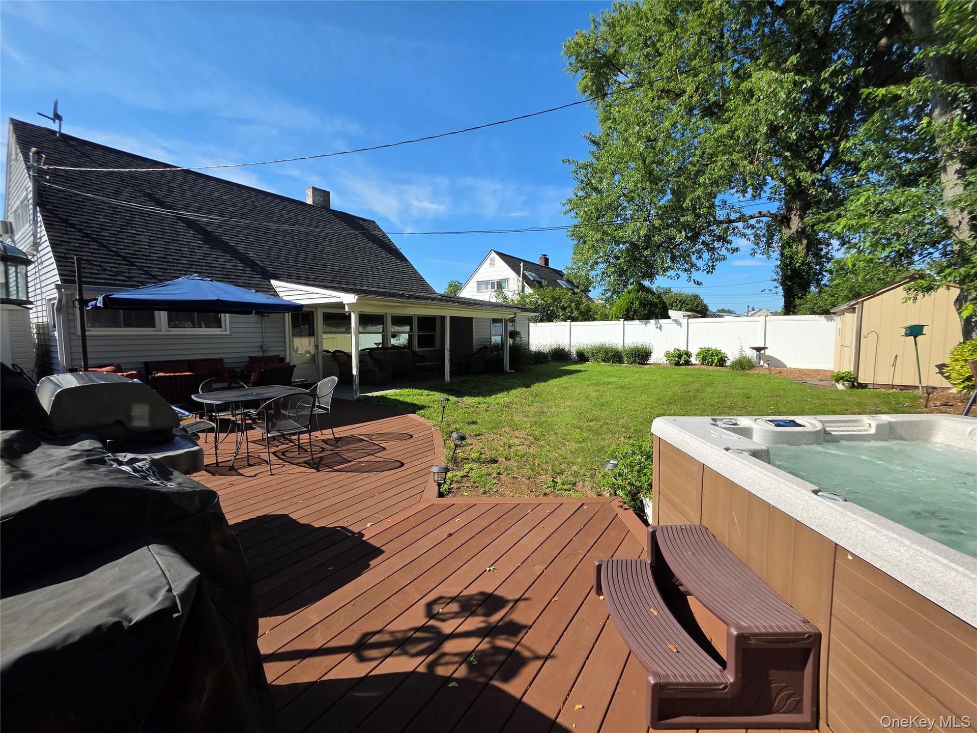 Enjoy a low maintenance composite wood deck with a hot tub to seat 6 people!
