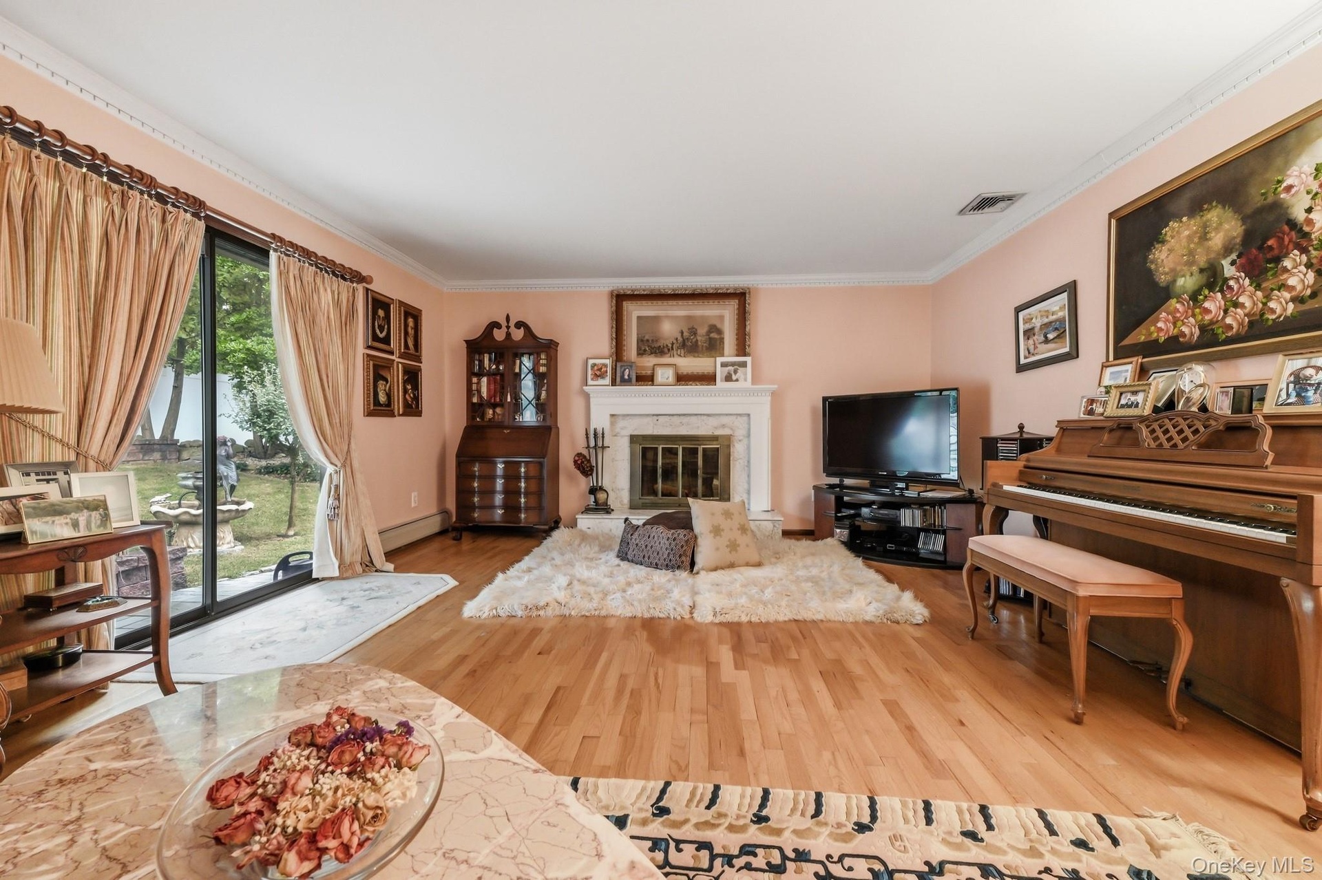 Oversized sliders and marble surround fireplace