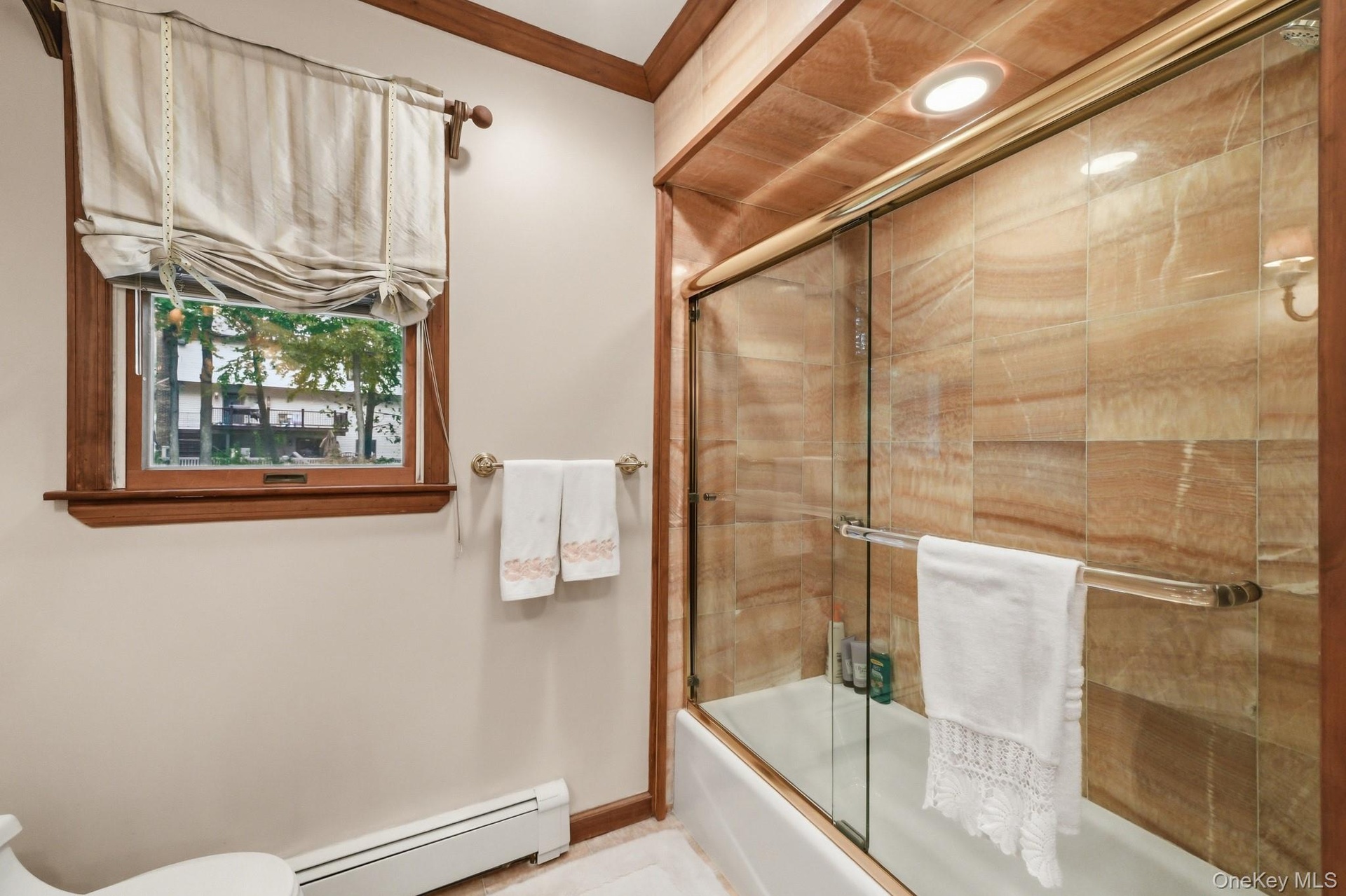 Tub with glass enclosure