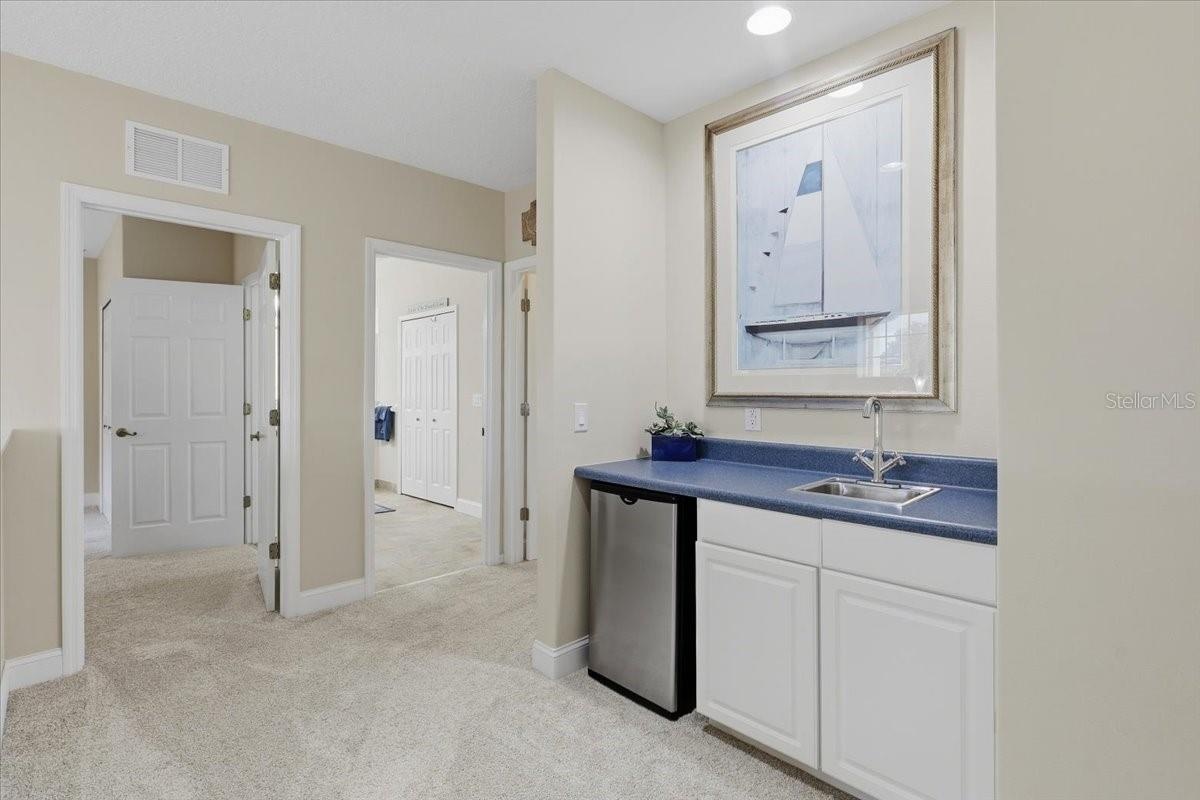 Upstairs wet bar potential space for 3rd bathroom
