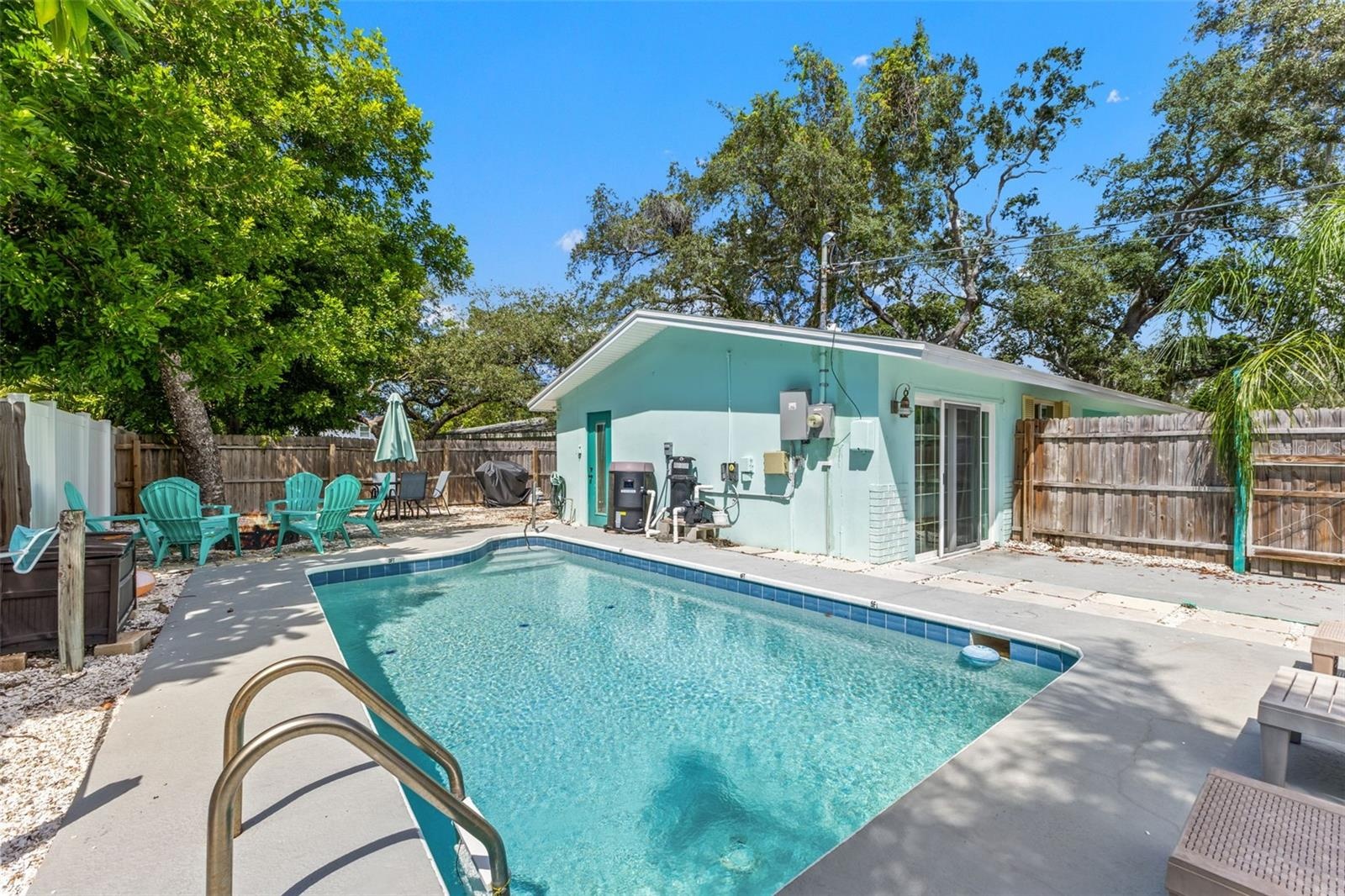 Another view of the private pool and fully fenced outdoor space, with direct access to the home.