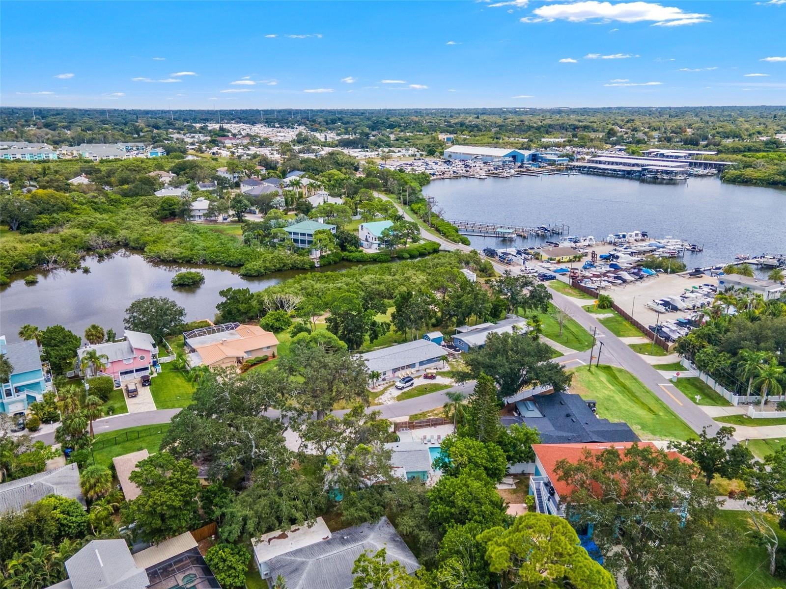 Aerial view showcasing the home’s location in Ozona, surrounded by marinas, waterways, and the area’s coastal setting.