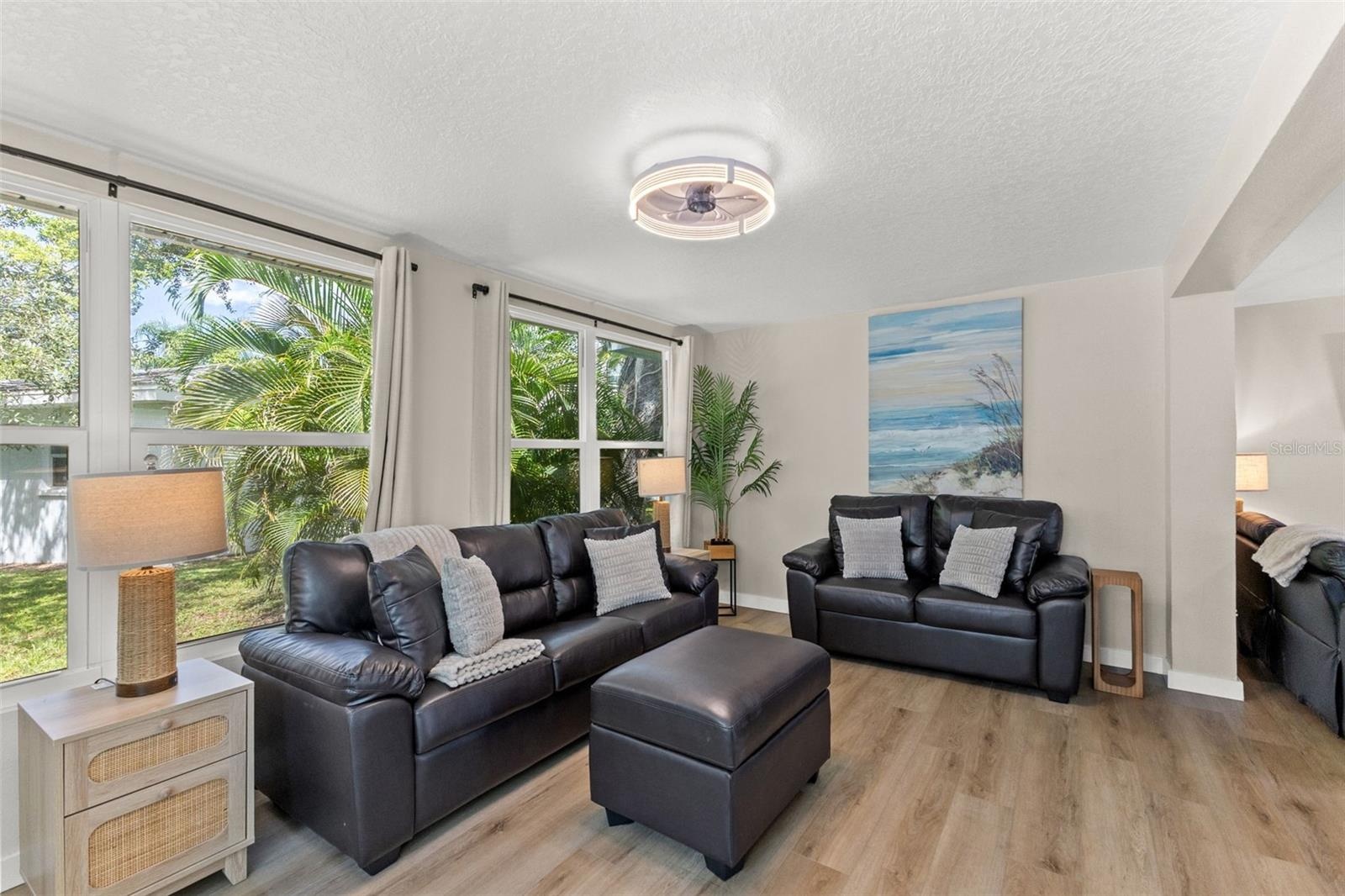 The home’s single-story layout offers generous, connected living spaces with updated flooring and a bright, neutral interior.