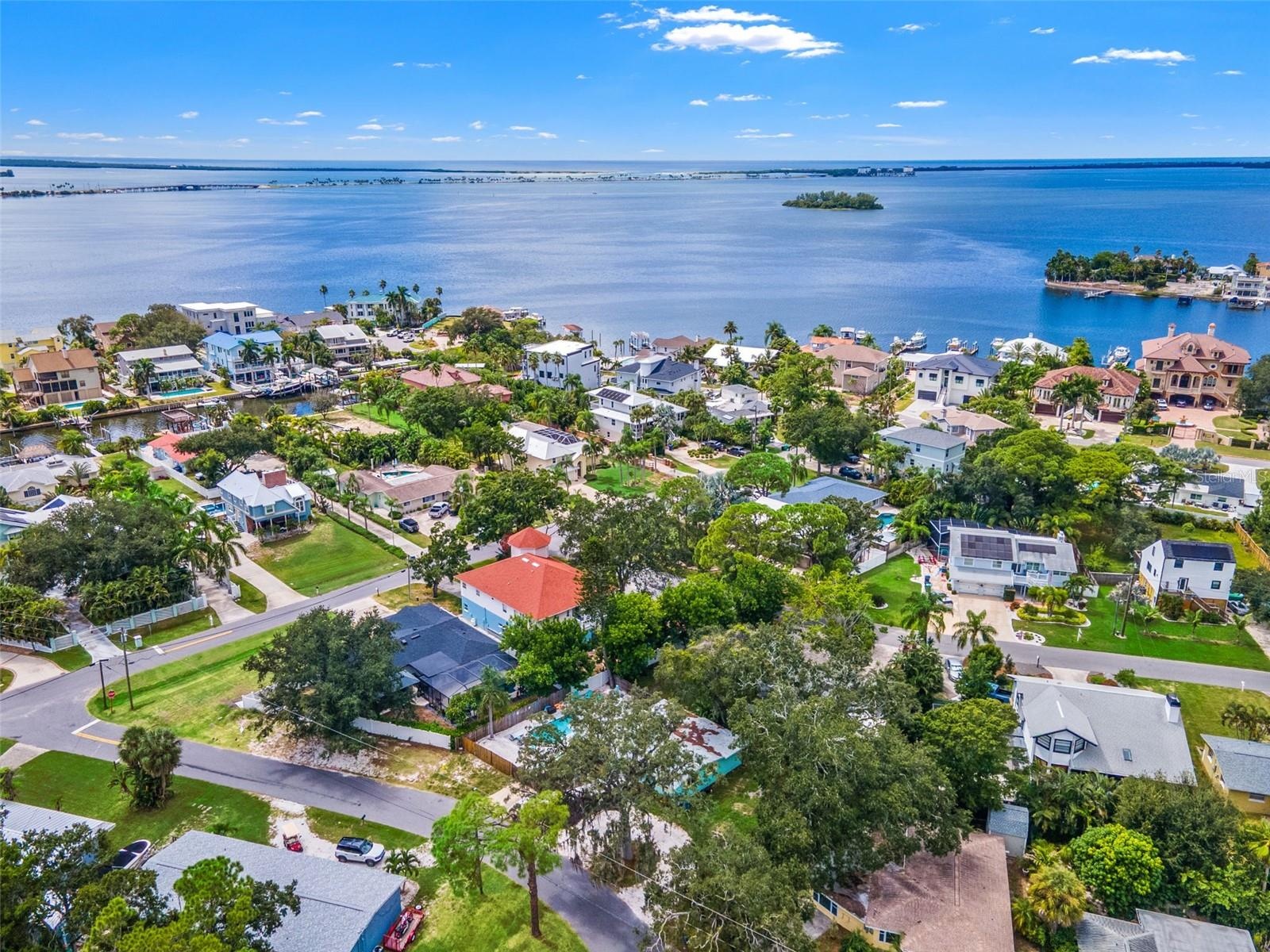 Ozona’s unique setting comes into view, with nearby waterfront neighborhoods and the open waters of St. Joseph Sound beyond.