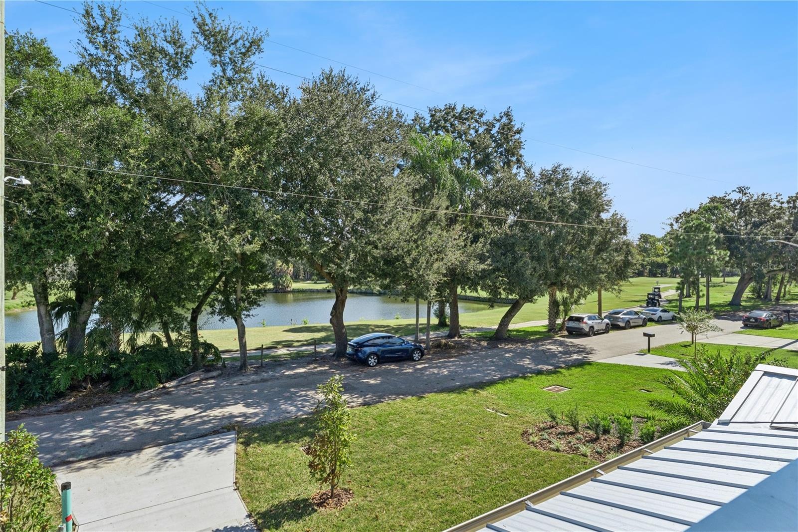 An upper-level outlook takes in the pond and trees across the street.