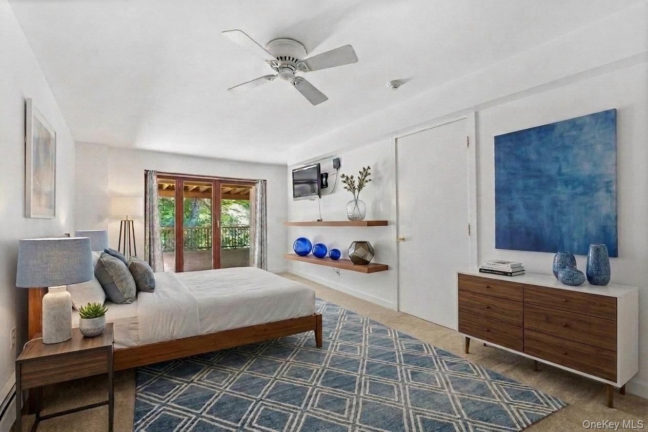 Located on the lower level, this bedroom has been virtually staged to showcase the warmth and charm of the space—an inviting  space for guests or mult