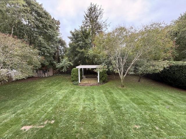 huge yard with 2 storage sheds