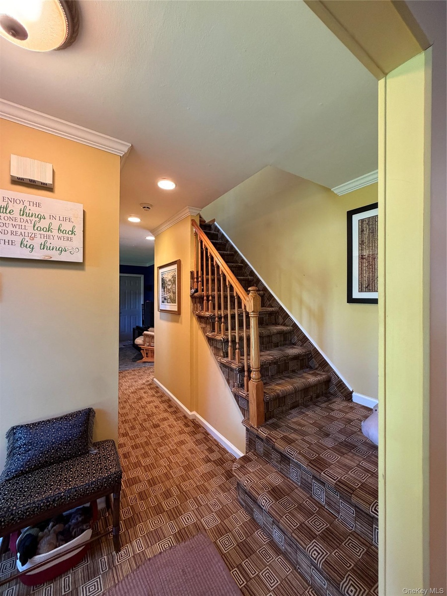 Entry from the front door, right to the living room, left to a full bath, and currently a den.