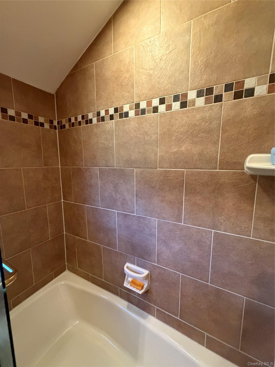 Generous 2nd tub with shower and glass enclosure