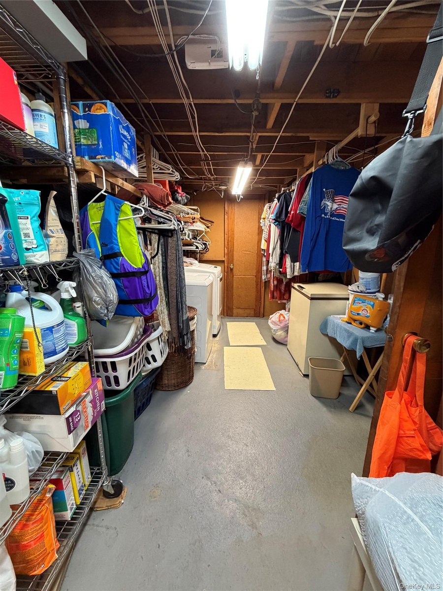Washer/Dryer, chest freezer, and more in this storage area in the basement