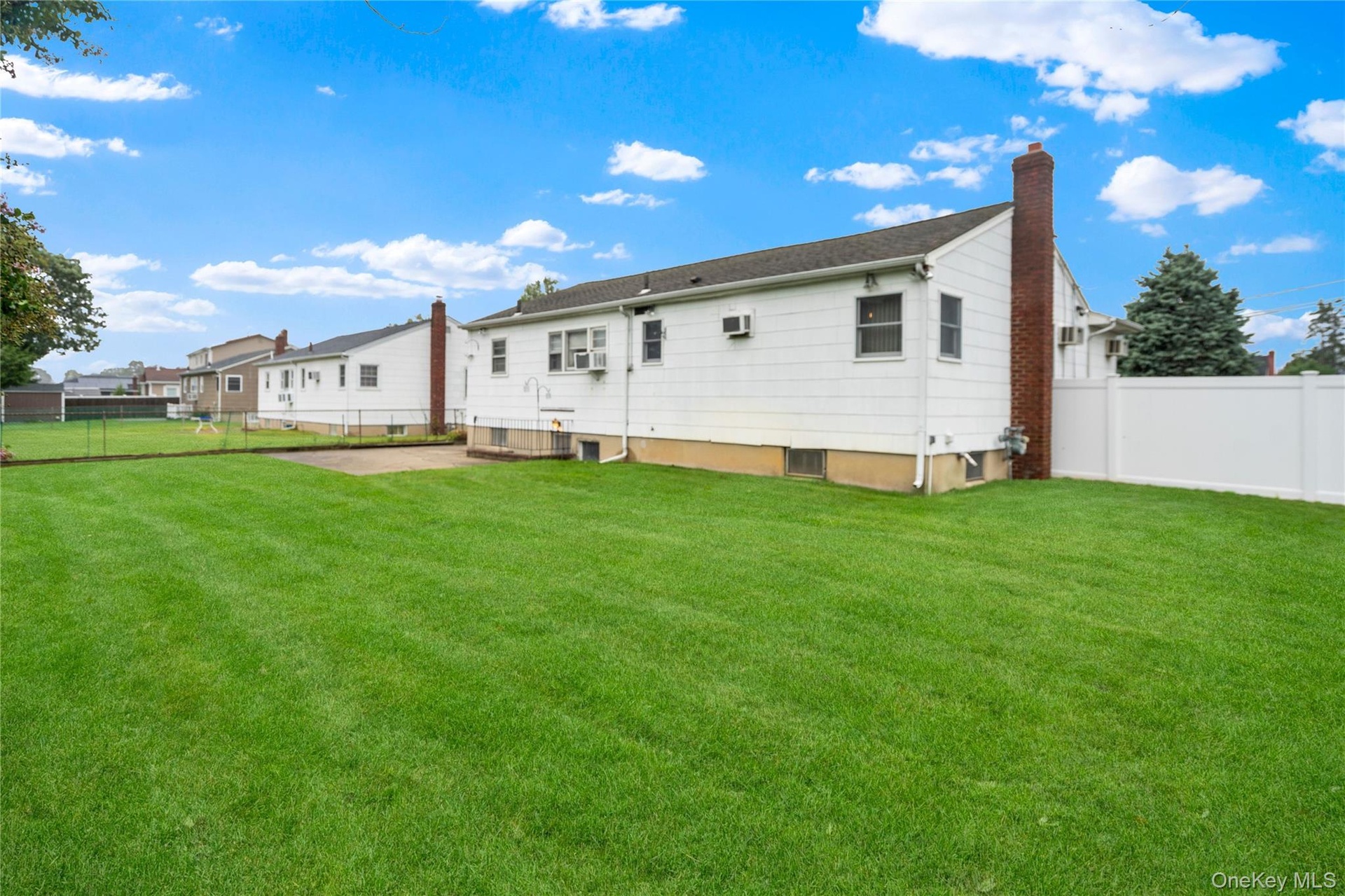 There is an architectural roof (approx. 20 yrs), the sides & rear of the home have builder's shingle siding...