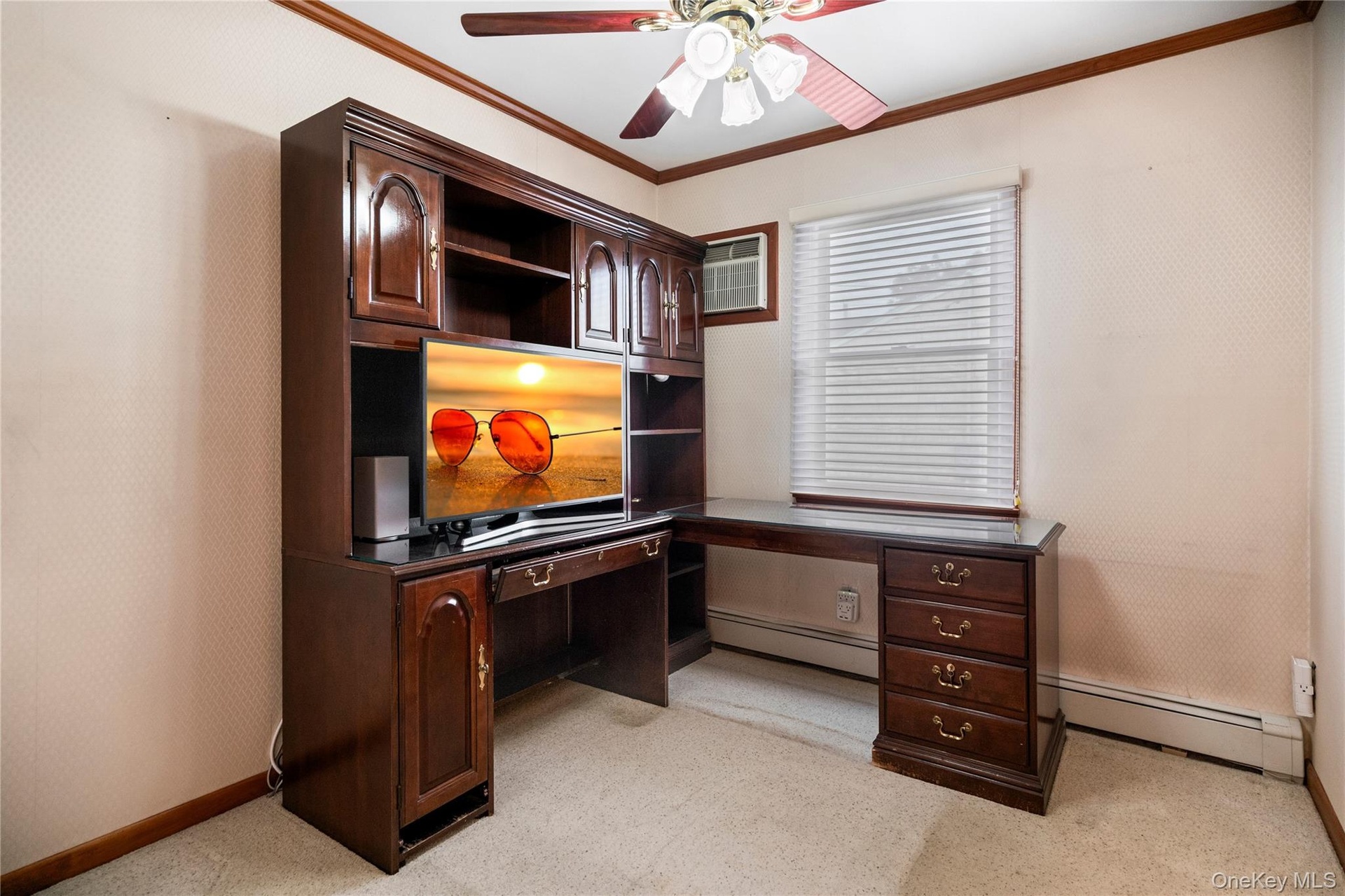 The 2nd bedroom is in the middle of the hallway and was used as the home office.