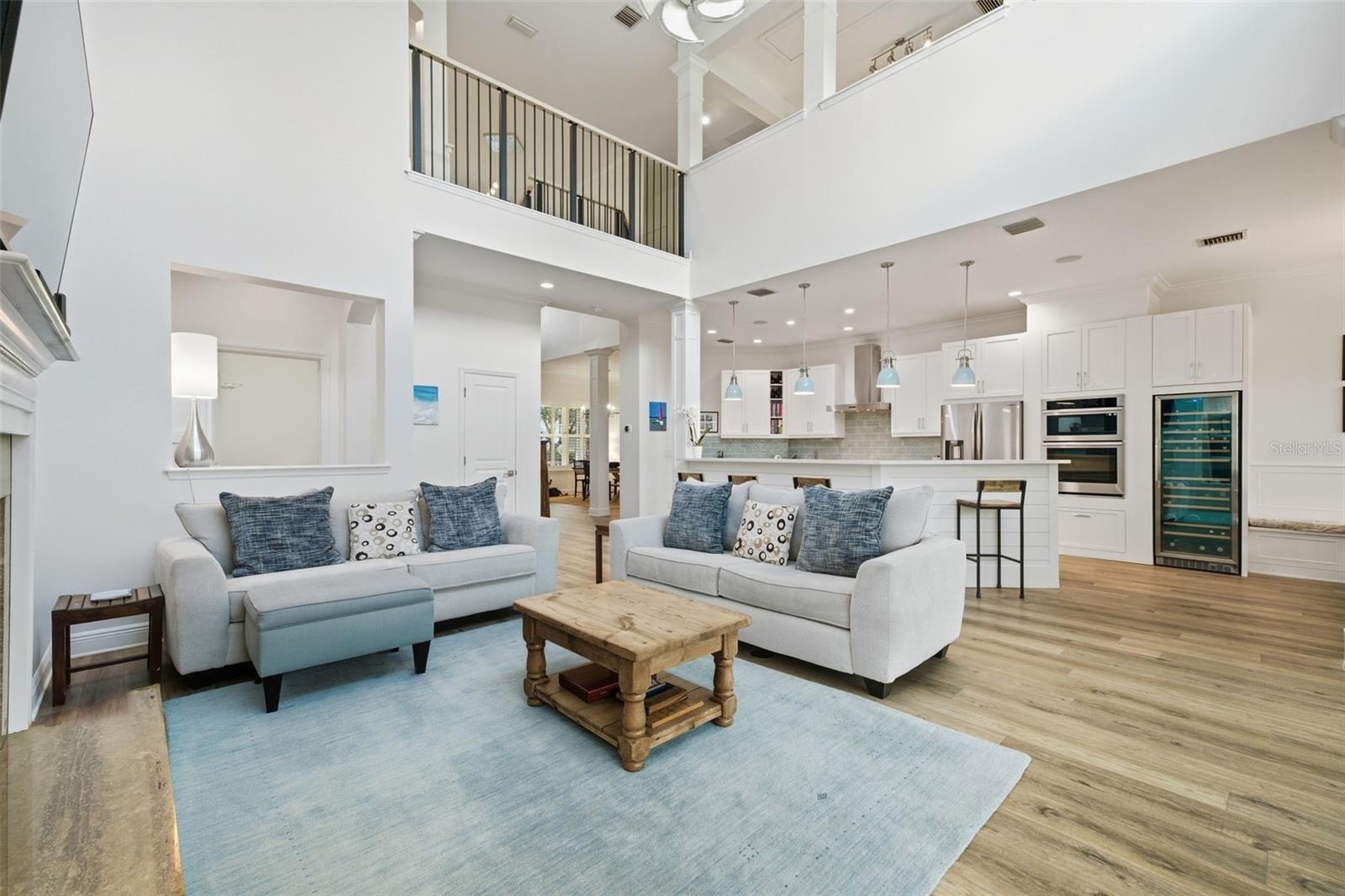 High ceilings in this welcoming family room filled with natural light