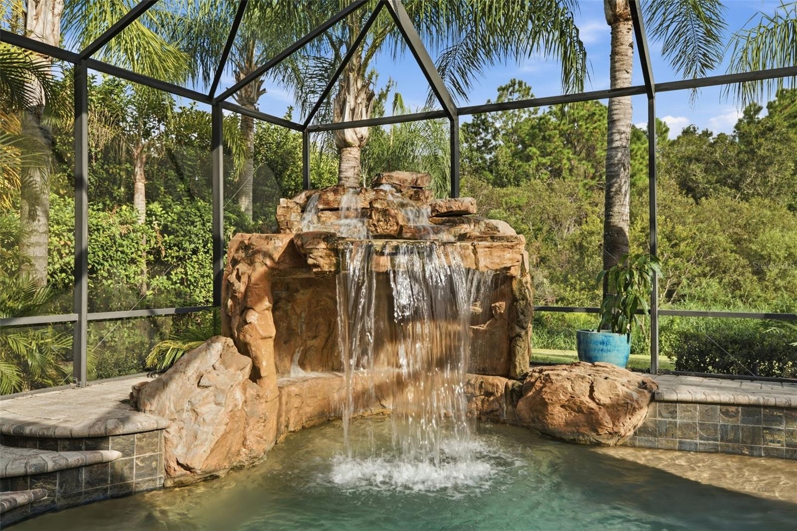 Open up your quad sliders to enjoy the peaceful sounds of your very own waterfall
