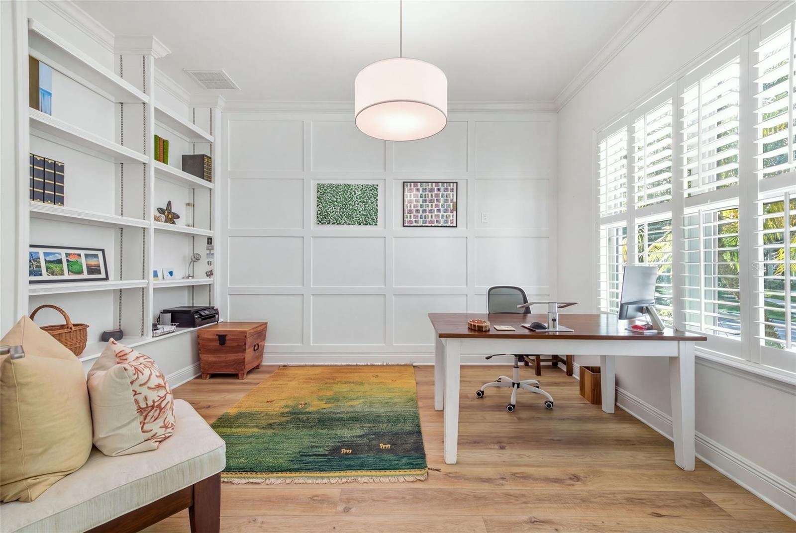 Private office with french doors & built in shelving