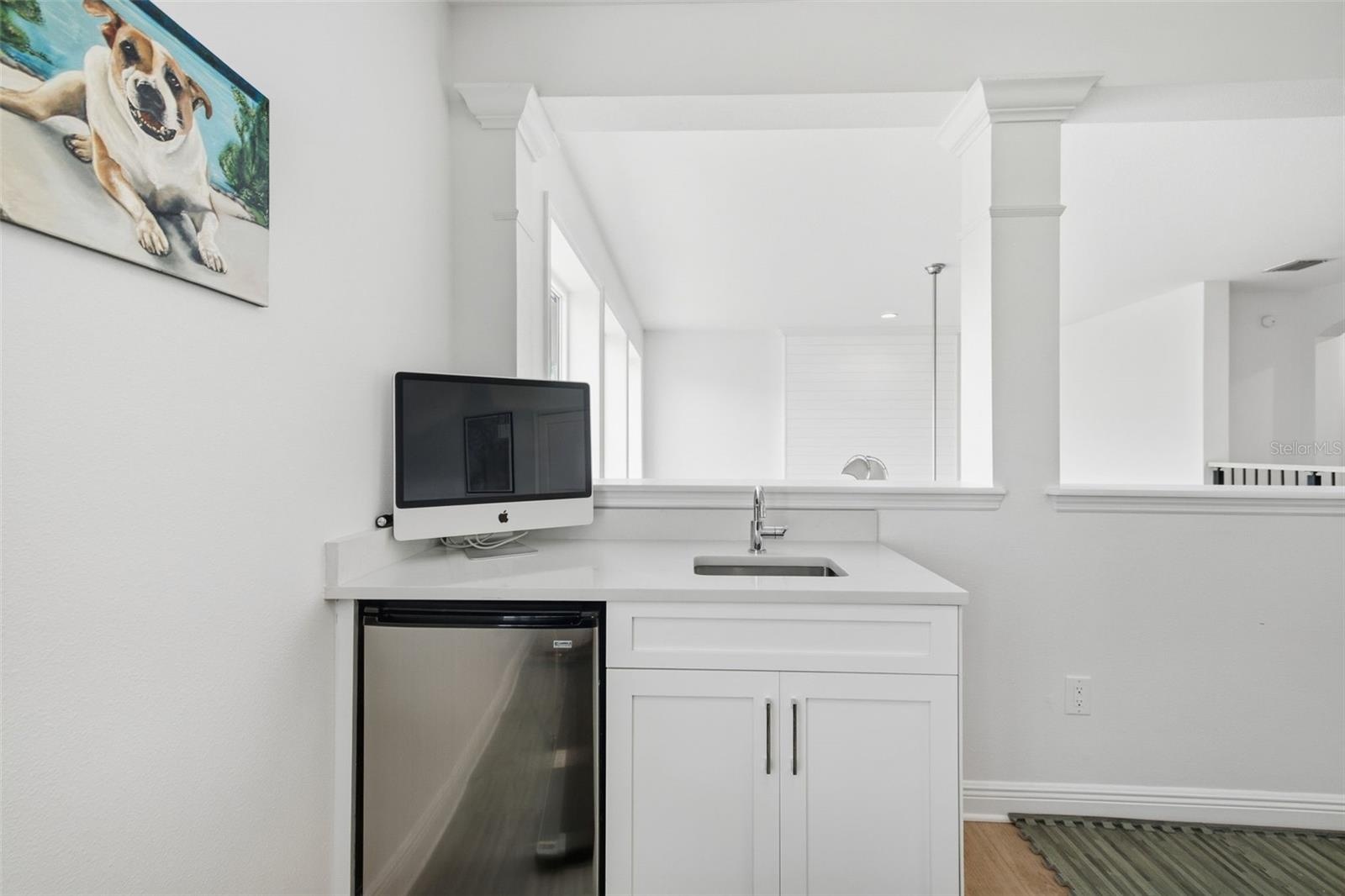 Loft has a wet bar with mini fridge