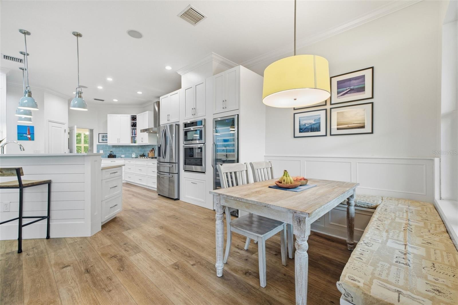 Breakfast nook with built in benches that add additional hidden storage