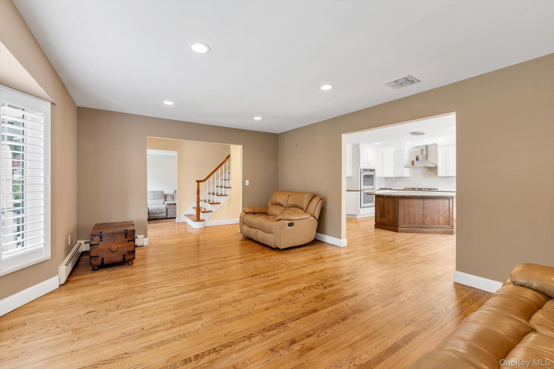 Entry to Upstairs and Living Room to Kitchen