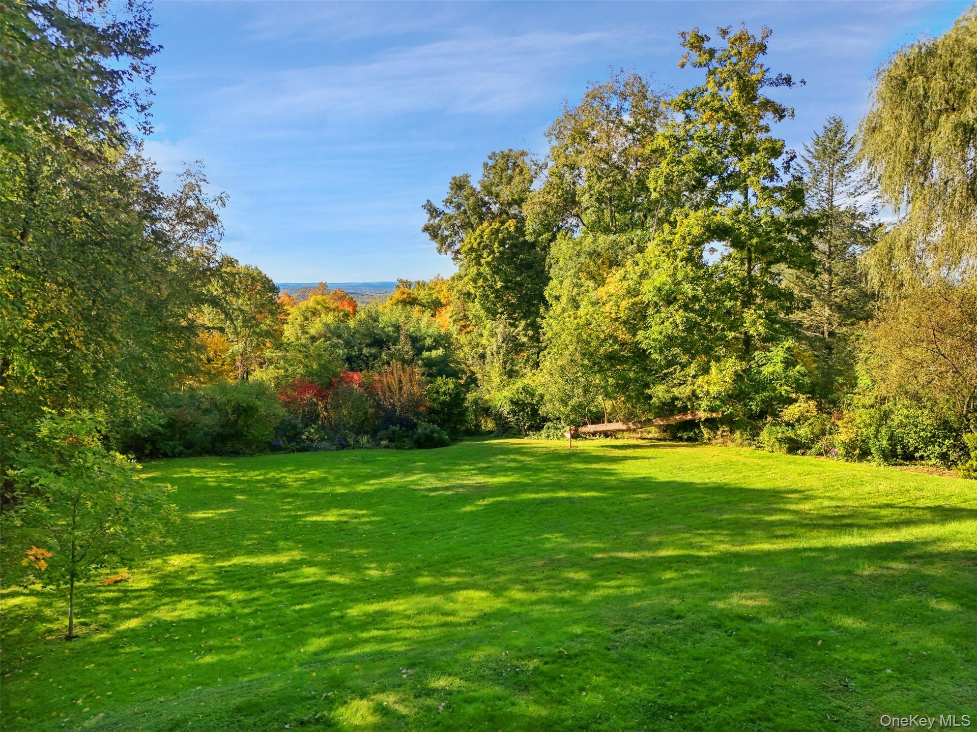 Spectacular west-facing views of the property from the living room & deck.