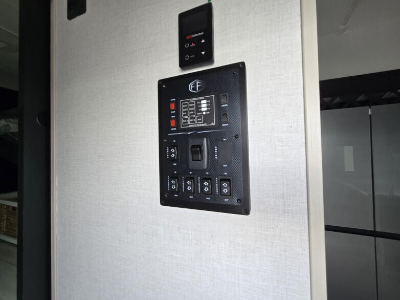 RV: Display panel inside entrance door to control lighting and water supply and water heating