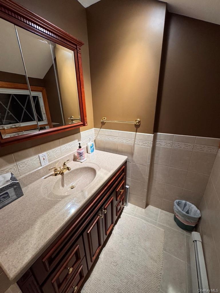 Half bath, upstairs hallway, toilet and sink, can be made to be a full bath