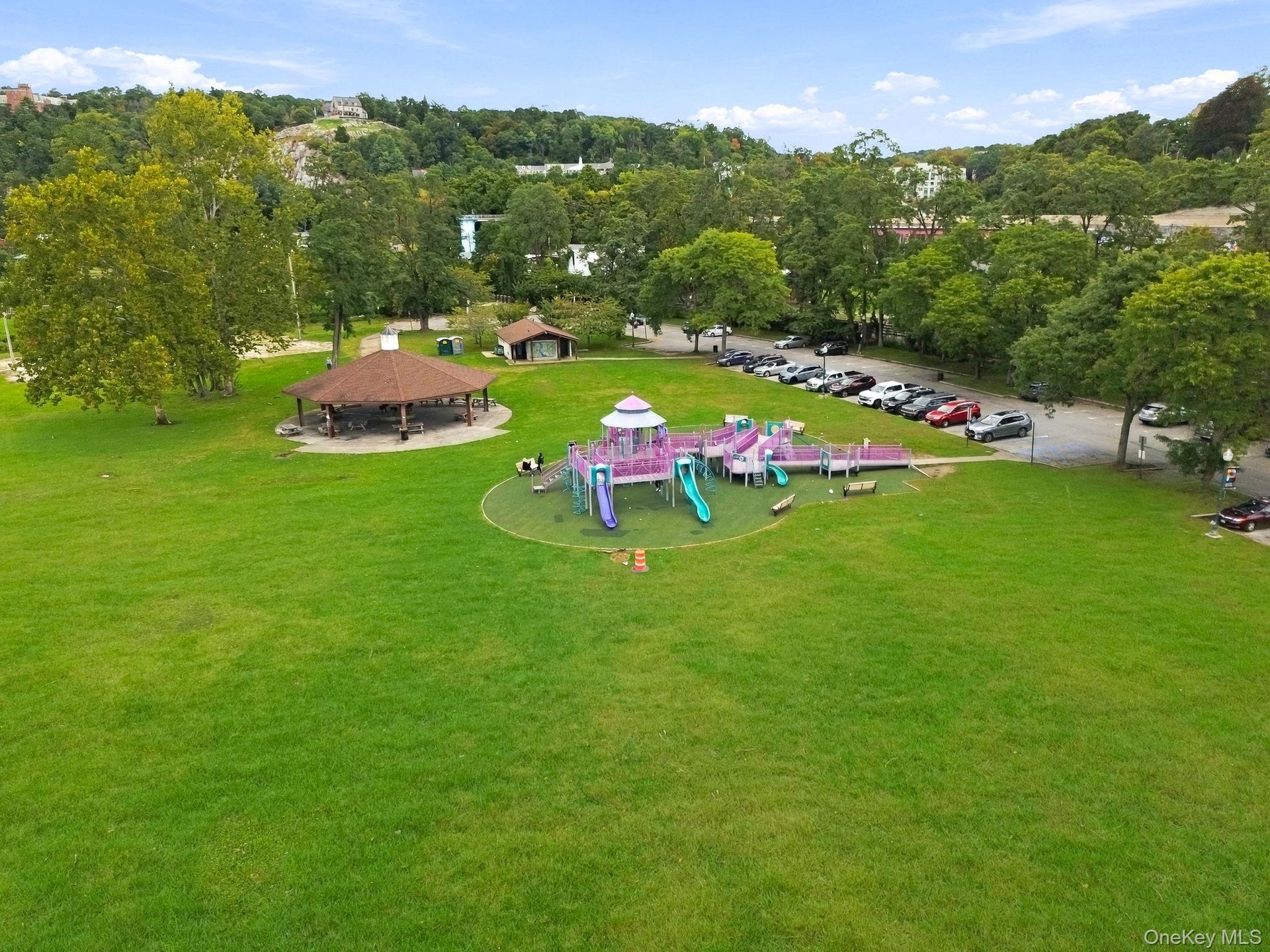Nearby riverfront park, with walking paths.
