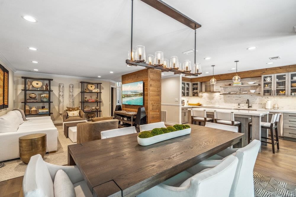 Wood-finish flooring throughout, with recessed lighting and a wood-beamed ceiling