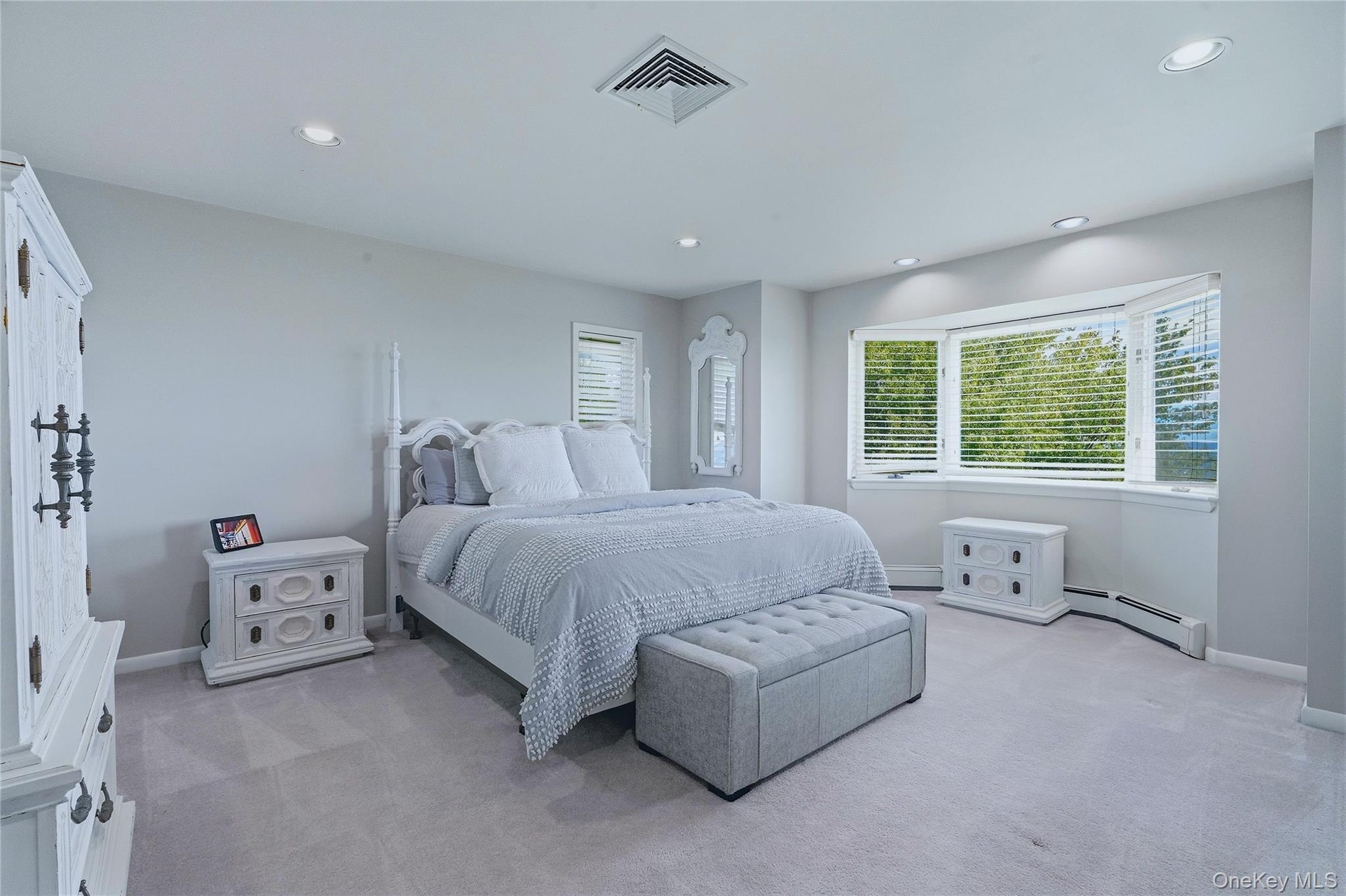Bedroom 2, recessed lighting, large bay window, light grey wall paint, grey carpet, and window blinds and views