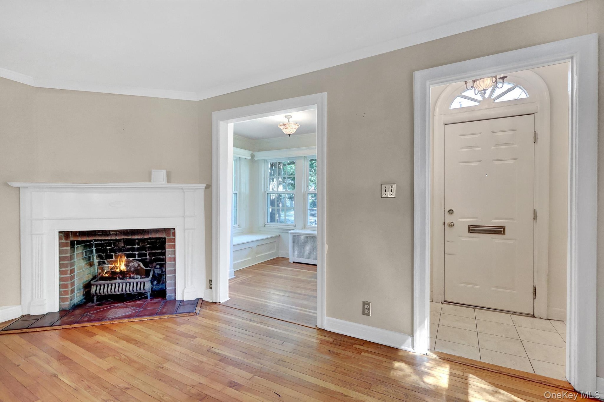 Non Staged Living room showing den and Foyer