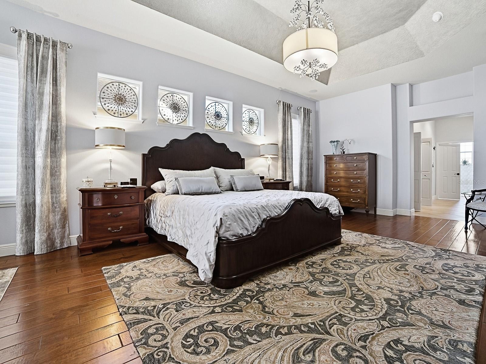 TO THE RIGHT IS THE HALLWAY LEADING TO YOUR EN-SUITE BATH WITH SPACIOUS CLOSETS AND BUILT-INS!