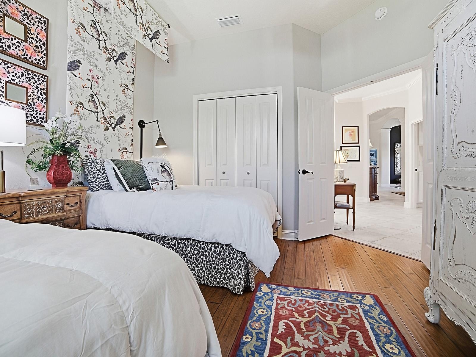 THIS ROOM ALSO HAS A DOUBLE DOOR CLOSET WITH BUILT-INS.