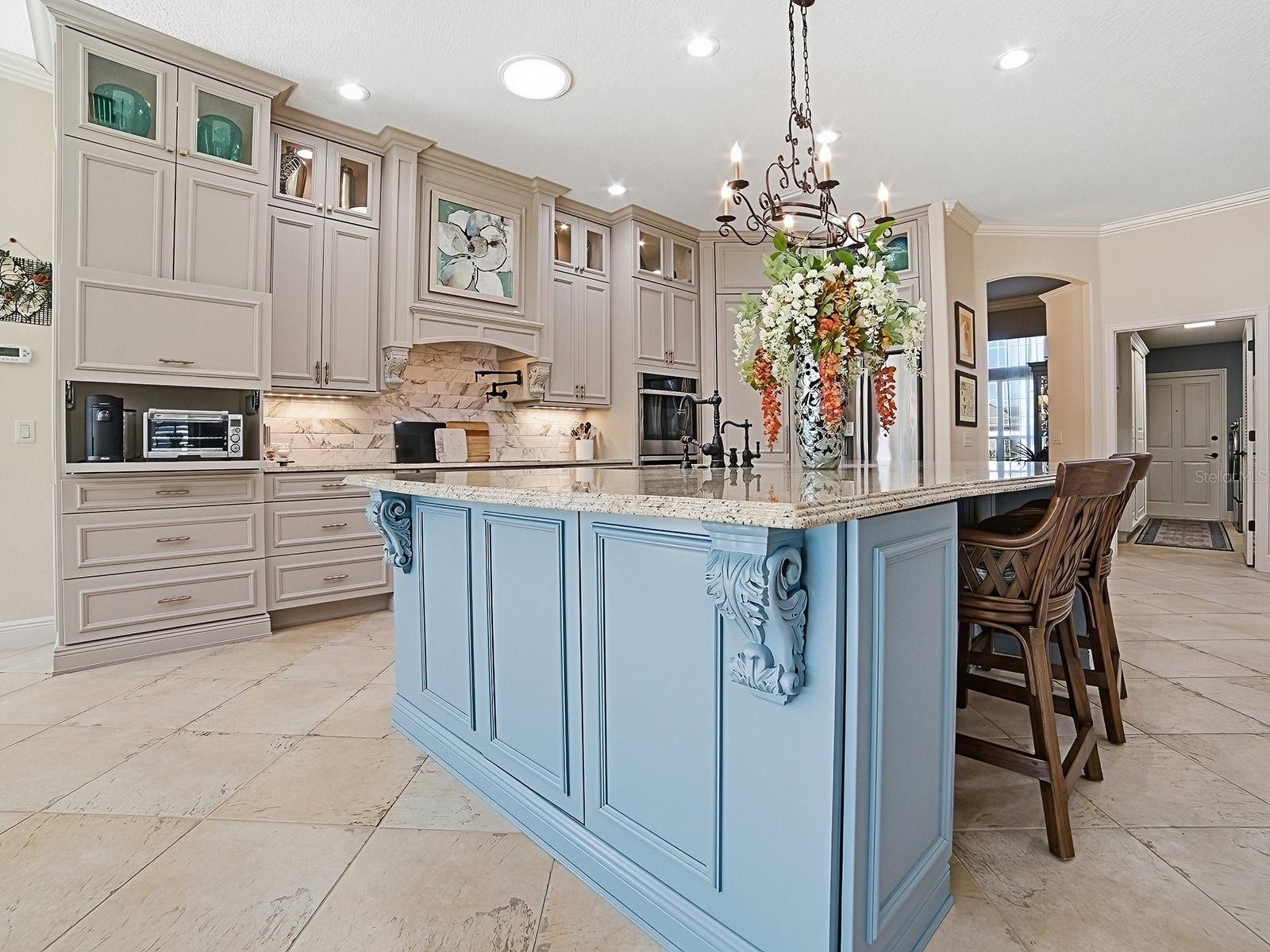 AROUND THE CORNER FROM THE DINING ROOM, YOU'LL FIND THE COMPLETELY RENOVATED, STUNNING KITCHEN.